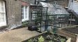 The greenhouse and vegetable beds at Hopkinson House